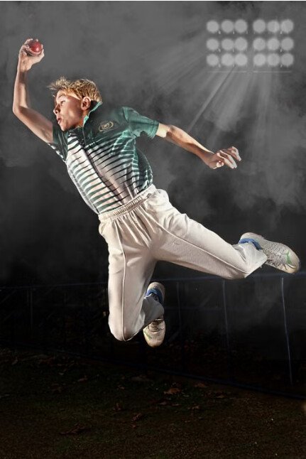 USCC cricketer bowling in club kit